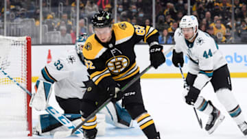 Oct 24, 2021; Boston, Massachusetts, USA; Boston Bruins center Oskar Steen (62) controls the puck in front of San Jose Sharks goaltender Adin Hill (33) while defenseman Marc-Edouard Vlasic (44) defends during the first period at TD Garden. Mandatory Credit: Bob DeChiara-USA TODAY Sports