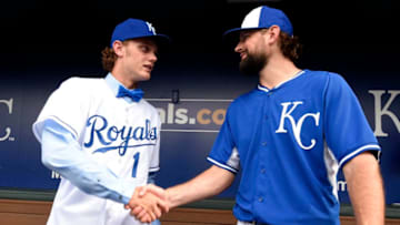 After signing with the Kansas City Royals, number one draft pick Ashe Russell meets with Luke Hochevar #44 of the Kansas City Royals Photo by Ed Zurga/Getty Images)