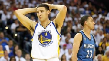 Apr 14, 2014; Oakland, CA, USA; Golden State Warriors guard Klay Thompson (11) reacts after being called for a foul against Minnesota Timberwolves guard Kevin Martin (23) during the second quarter at Oracle Arena. Mandatory Credit: Kelley L Cox-USA TODAY Sports