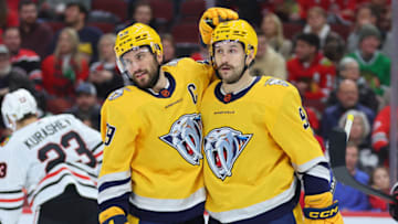 Roman Josi #59 and Filip Forsberg #9 of the Nashville Predators celebrate after scoring a goal against the Chicago Blackhawks during the third period at United Center on December 21, 2022 in Chicago, Illinois. (Photo by Michael Reaves/Getty Images)