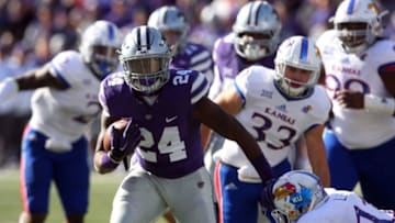 Nov 26, 2016; Manhattan, KS, USA; Kansas State Wildcats running back Charles Jones (24) breaks away from the Kansas Jayhawks during a game at Bill Snyder Family Football Stadium. Mandatory Credit: Scott Sewell-USA TODAY Sports