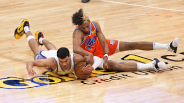 Kings guard-forward Justin James (10) dives for the ball against OKC Thunder guard Charlie Brown Jr. : Kelley L Cox-USA TODAY Sports