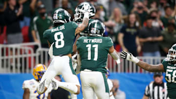 Dec 30, 2021; Atlanta, GA, USA; Michigan State Spartans wide receiver Jayden Reed (1) celebrates after a touchdown catch with wide receiver Jalen Nailor (8) and tight end Connor Heyward (11) against the Pittsburgh Panthers in the first quarter during the 2021 Peach Bowl at Mercedes-Benz Stadium. Mandatory Credit: Brett Davis-USA TODAY Sports