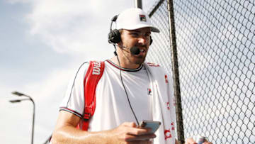 WEST PALM BEACH, FLORIDA - MAY 09: Reilly Opelka of the United States enters his score on his phone as he is interviewed by Tennis Channel after winning the UTR Pro Match Series championship on May 09, 2020 in West Palm Beach, Florida. (Photo by Michael Reaves/Getty Images)