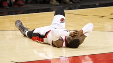 Mar 5, 2015; Portland, OR, USA; Portland Trail Blazers guard Wesley Matthews (2) grimaces in pain in the third quarter against Dallas Mavericks at Moda Center at the Rose Quarter. Mandatory Credit: Jaime Valdez-USA TODAY Sports