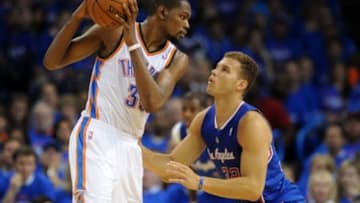 May 5, 2014; Oklahoma City, OK, USA; Oklahoma City Thunder forward Kevin Durant (35) handles the ball against Los Angeles Clippers forward Blake Griffin (32) during the second quarter in game one of the second round of the 2014 NBA Playoffs at Chesapeake Energy Arena. Mandatory Credit: Mark D. Smith-USA TODAY Sports