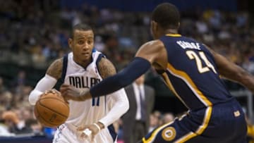 Oct 25, 2013; Dallas, TX, USA; Indiana Pacers shooting guard Paul George (24) defends against Dallas Mavericks point guard Monta Ellis (11) during the second half at the American Airlines Center. The Pacers defeated the Mavericks 98-77. Mandatory Credit: Jerome Miron-USA TODAY Sports
