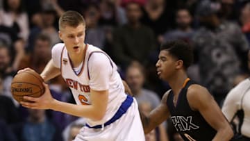 PHOENIX, AZ - DECEMBER 13: Kristaps Porzingis #6 of the New York Knicks handles the ball against Marquese Chriss #0 of the Phoenix Suns during the second half of the NBA game at Talking Stick Resort Arena on December 13, 2016 in Phoenix, Arizona. The Suns defeated the Knicks 113-111. (Photo by Christian Petersen/Getty Images)