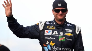 Jul 9, 2016; Sparta, KY, USA; NASCAR Sprint Cup Series driver Dale Earnhardt Jr. (88) waves to the fans during driver introductions prior to the Quaker State 400 presented by Advance Auto Parts at Kentucky Speedway. Mandatory Credit: Christopher Hanewinckel-USA TODAY Sports