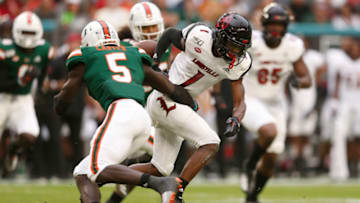MIAMI, FLORIDA - NOVEMBER 09: Tutu Atwell #1 of the Louisville Cardinals fumbles the ball against the Miami Hurricanes during the first half at Hard Rock Stadium on November 09, 2019 in Miami, Florida. (Photo by Michael Reaves/Getty Images)