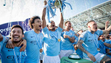 BRIGHTON, ENGLAND - MAY 12: Vincent Kompany of Manchester City lifts the Premier League trophy after the Premier League match between Brighton & Hove Albion and Manchester City at American Express Community Stadium on May 12, 2019 in Brighton, United Kingdom. (Photo by Michael Regan/Getty Images)