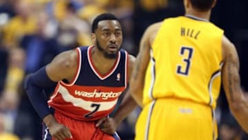 May 5, 2014; Indianapolis, IN, USA; Indiana Pacers guard George Hill (3) is guarded by Washington Wizards guard John Wall (2) in game one of the second round of the 2014 NBA Playoffs at Bankers Life Fieldhouse. Mandatory Credit: Brian Spurlock-USA TODAY Sports