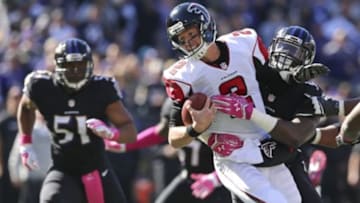 Oct 19, 2014; Baltimore, MD, USA; Atlanta Falcons quarterback Matt Ryan (2) is sacked by Baltimore Ravens linebacker Pernell McPhee (90) at M&T Bank Stadium. Mandatory Credit: Mitch Stringer-USA TODAY Sports