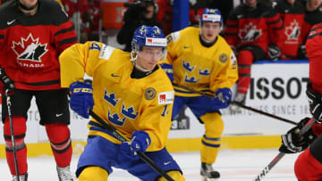 BUFFALO, NY - JANUARY 5: Elias Pettersson #14 of Sweden in play against Canada during the Gold medal game of the IIHF World Junior Championship at KeyBank Center on January 5, 2018 in Buffalo, New York. Canada beat Sweden 3-1. (Photo by Kevin Hoffman/Getty Images)