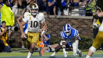 Sep 30, 2023; Durham, North Carolina, USA; Duke Blue Devils linebacker Tre Freeman (12) chases Notre Dame Fighting Irish quarterback Sam Hartman (10) in the end zone during the second half at Wallace Wade Stadium. Mandatory Credit: Jim Dedmon-USA TODAY Sports