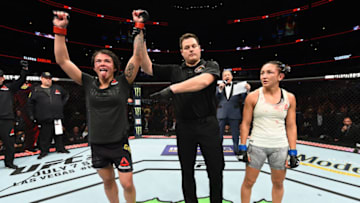 CHICAGO, ILLINOIS - JUNE 09: (L-R) Claudia Gadelha of Brazil reacts after defeating Carla Esparza in their women's strawweight fight during the UFC 225 event at the United Center on June 9, 2018 in Chicago, Illinois. (Photo by Josh Hedges/Zuffa LLC/Zuffa LLC via Getty Images)
