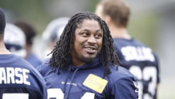 Jun 17, 2014; Renton, WA, USA; Seattle Seahawks running back Marshawn Lynch (24) talks with a teammate during minicamp at the Virginia Mason Athletic Center. Mandatory Credit: Joe Nicholson-USA TODAY Sports