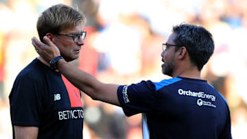 HUDDERSFIELD, ENGLAND - JULY 20: David Wagner (R) manager of Huddersfield Town greets Juergen Klopp manager of Liverpool prior the Pre-Season Friendly match between Huddersfield Town and Liverpool at the Galpharm Stadium on July 20, 2016 in Huddersfield, England. (Photo by Nigel Roddis/Getty Images)