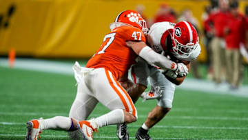 Sep 4, 2021; Charlotte, North Carolina, USA; Georgia Bulldogs tight end Brock Bowers (19) is stopped by Clemson Tigers linebacker James Skalski (47) during the first quarter at Bank of America Stadium. Mandatory Credit: Jim Dedmon-USA TODAY Sports