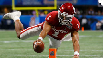 ATLANTA, GEORGIA - DECEMBER 28: Quarterback Jalen Hurts #1 of the Oklahoma Sooners dives towards the pylon for a second half touchdown during the College Football Playoff Semifinal at the Chick-fil-A Peach Bowl against the LSU Tigers at Mercedes-Benz Stadium on December 28, 2019 in Atlanta, Georgia. (Photo by Mike Zarrilli/Getty Images)