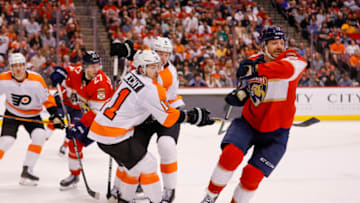 Mar 10, 2022; Sunrise, Florida, USA; Florida Panthers center Sam Reinhart (13) skates after the puck ahead of Philadelphia Flyers right wing Travis Konecny (11) during the second period of the game at FLA Live Arena. Mandatory Credit: Sam Navarro-USA TODAY Sports