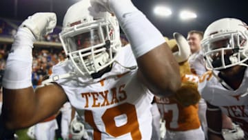 FORT WORTH, TX - OCTOBER 27: Peter Jinkens #19 of the Texas Longhorns celebrates after the Longhorns beat the TCU Horned Frogs 30-7 at Amon G. Carter Stadium on October 27, 2013 in Fort Worth, Texas. (Photo by Tom Pennington/Getty Images)