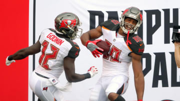 TAMPA, FL - OCT 01: Chris Godwin (12) of the Bucs celebrates the touchdown that O. J. Howard (80) just scored as Howard is all smiles during the NFL Regular game between the New York Giants and the Tampa Bay Buccaneers on October 01, 2017 at Raymond James Stadium in Tampa, Florida. (Photo by Cliff Welch/Icon Sportswire via Getty Images)