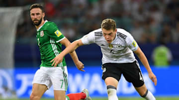 SOCHI, RUSSIA - JUNE 29: Matthias Ginter of Germany is challenged by Miguel Layn of Mexico during the FIFA Confederations Cup Russia 2017 semi final match between Germany and Mexico at Fisht Olympic Stadium on June 29, 2017 in Sochi, Russia. (Photo by Stuart Franklin - FIFA/FIFA via Getty Images)