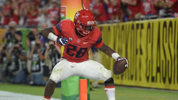 Sep 3, 2016; Glendale, AZ, USA; Arizona Wildcats running back Nick Wilson (28) celebrates a touchdown against the Brigham Young Cougars during the second half at University of Phoenix Stadium. The Cougars won 18-16. Mandatory Credit: Joe Camporeale-USA TODAY Sports