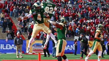 Dec 21, 2013; Albuquerque, NM, USA; Colorado State Rams wide receiver Charles Lovett (4) celebrates with teammates after catching a touchdown in the first quarter against the Washington State Cougars during the Gildan New Mexico Bowl at University Stadium. Mandatory Credit: Mark J. Rebilas-USA TODAY Sports