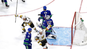 Jonathan Marchessault #81 and Paul Stastny #26 of the Vegas Golden Knights celebrate a goal by teammate Mark Stone (not pictured) past Jacob Markstrom #25 of the Vancouver Canucks during the third period in Game Three of the Western Conference Second Round. (Photo by Bruce Bennett/Getty Images)