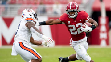 Auburn footballNov 28, 2020; Tuscaloosa, Alabama, USA; Alabama running back Najee Harris (22) stiff arms Auburn linebacker Owen Pappoe (0) at Bryant-Denny Stadium in the Iron Bowl. Mandatory Credit: Mickey Welsh/The Montgomery Advertiser via USA TODAY Sports