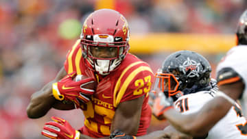 AMES, IA - NOVEMBER 11: Wide receiver Matthew Eaton #23 of the Iowa State Cyclones drives the ball for a touchdown as safety Tre Flowers #31 of the Oklahoma State Cowboys blocks in the first half of play at Jack Trice Stadium on November 11, 2017 in Ames, Iowa. (Photo by David Purdy/Getty Images)