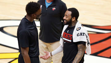 Bam Adebayo #13 of the Miami Heat laughs with John Wall #1 of the Houston Rockets(Photo by Michael Reaves/Getty Images)