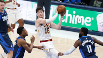 May 7, 2021; Dallas, Texas, USA; Cleveland Cavaliers forward Cedi Osman (16) passes the ball against Dallas Mavericks guard Josh Richardson (0) during the third quarter at American Airlines Center. Mandatory Credit: Tim Heitman-USA TODAY Sports