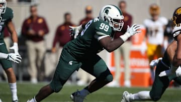 EAST LANSING, MI - SEPTEMBER 29: Raequan Williams #99 of the Michigan State Spartans rushes the quarterback while playing the Central Michigan Chippewas at Spartan Stadium on September 29, 2018 in East Lansing, Michigan. Michigan State won the game 31-20. (Photo by Gregory Shamus/Getty Images)