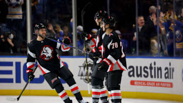 Jan 21, 2023; Buffalo, New York, USA; Buffalo Sabres center Dylan Cozens (24) celebrates his goal with teammates during the first period against the Anaheim Ducks at KeyBank Center. Mandatory Credit: Timothy T. Ludwig-USA TODAY Sports