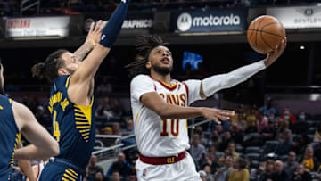 Mar 8, 2022; Indianapolis, Indiana, USA; Cleveland Cavaliers guard Darius Garland (10) shoots the ball while Indiana Pacers guard Duane Washington Jr. (4) defends in the first half at Gainbridge Fieldhouse. Mandatory Credit: Trevor Ruszkowski-USA TODAY Sports