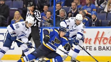 Oct 27, 2015; St. Louis, MO, USA; St. Louis Blues center Paul Stastny (26) and Tampa Bay Lightning defenseman Victor Hedman (77) battle for the puck during the second period at Scottrade Center. Mandatory Credit: Jasen Vinlove-USA TODAY Sports