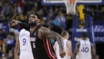 Feb 12, 2014; Oakland, CA, USA; Miami Heat forward LeBron James (6) reacts after recording an assist against the Golden State Warriors in the third quarter at Oracle Arena. The Heat defeated the Warriors 111-110. Mandatory Credit: Cary Edmondson-USA TODAY Sports