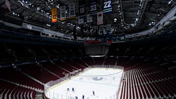 VANCOUVER, BC - JANUARY 4: Goalies Michael Dipietro #65 and Braden Holtby #49 of the Vancouver Canucks take to the ice ahead before the main group for the start of the Vancouver Canucks NHL Training Camp at Rogers Arena on January 4, 2021 in Vancouver, British Columbia, Canada. (Photo by Rich Lam/Getty Images)