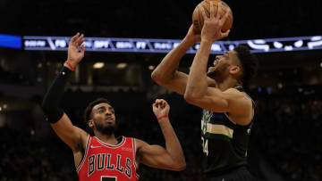MILWAUKEE, WISCONSIN - JANUARY 21: Giannis Antetokounmpo #34 of the Milwaukee Bucks is defended by Troy Brown Jr. #7 of the Chicago Bulls during the second half of a game at Fiserv Forum on January 21, 2022 in Milwaukee, Wisconsin. NOTE TO USER: User expressly acknowledges and agrees that, by downloading and or using this photograph, User is consenting to the terms and conditions of the Getty Images License Agreement. (Photo by Stacy Revere/Getty Images)