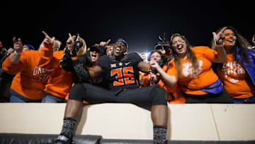 Nov 12, 2016; Stillwater, OK, USA; Oklahoma State Cowboys safety Derrick Moncrief (36) celebrates with fans after the game against the Texas Tech Red Raiders at Boone Pickens Stadium. Cowboys won 45-44. Mandatory Credit: Rob Ferguson-USA TODAY Sports