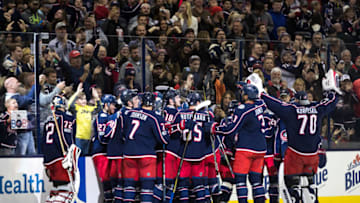 COLUMBUS, OH - NOVEMBER 22: Columbus Blue Jackets right wing Josh Anderson (77) celebrates with teammates after scoring the game winning goal during overtime in a game between the Columbus Blue Jackets and the Calgary Flames on November 22, 2017, at Nationwide Arena in Columbus, OH. Blue Jackets defeated the Flames 1-0 in overtime.(Photo by Adam Lacy/Icon Sportswire via Getty Images)