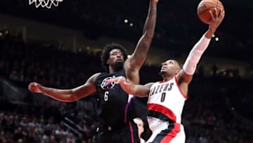 Oct 27, 2016; Portland, OR, USA; Los Angeles Clippers center DeAndre Jordan (6) defends Portland Trail Blazers guard Damian Lillard (0) at Moda Center. Mandatory Credit: Jaime Valdez-USA TODAY Sports