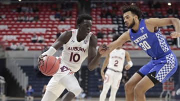 Auburn basketballJan 16, 2021; Auburn, Alabama, USA; Auburn Tigers forward JT Thor (10) moves against Kentucky Wildcats forward Oliver Starr (30) during the first half at Auburn Arena. Mandatory Credit: John Reed-USA TODAY Sports