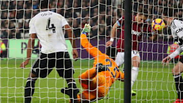 LONDON, ENGLAND - FEBRUARY 22: Javier Hernandez of West Ham United scores his side's first goal past Sergio Rico of Fulham during the Premier League match between West Ham United and Fulham FC at the London Stadium on February 22, 2019 in London, United Kingdom. (Photo by Catherine Ivill/Getty Images)