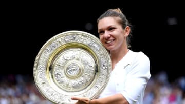 Simona Halep celebrates with the trophy after winning the women's singles final following the women's singles final on day twelve of the Wimbledon Championships at the All England Lawn Tennis and Croquet Club, Wimbledon. (Photo by Laurence Griffiths/PA Images via Getty Images)