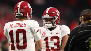 Alabama Crimson Tide quarterback Tua Tagovailoa (13) and quarterback Mac Jones (10) during warm-ups prior to the SEC championship game against the Georgia Bulldogs at Mercedes-Benz Stadium. Mandatory Credit: Jason Getz-USA TODAY Sports