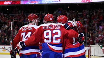 WASHINGTON, DC - MARCH 08: Nicklas Backstrom #19 of the Washington Capitals celebrates with his teammates after scoring a goal in the third period against the New Jersey Devils at Capital One Arena on March 8, 2019 in Washington, DC. (Photo by Patrick McDermott/NHLI via Getty Images)